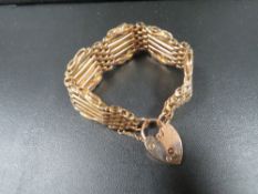 A hallmarked 9 carat gold gate bracelet with spare links approx. total weight 25.3g