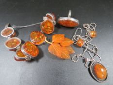A collection of silver and amber jewellery