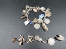 A silver charm bracelet and charms