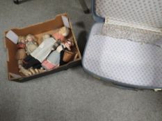 A small collection of antique dolls to include miniature examples in a vintage suitcase