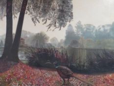 An early 20th century oil on canvas wooded river landscape with pheasant