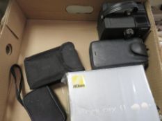 A tray of vintage cameras