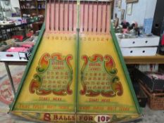 A MID 20TH CENTURY PAINTED WOOD FAIRGROUND ROLL A BALL GAME BOARD, mainly in green and yellow, 145