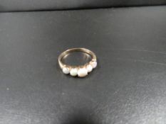 A hallmarked 9 carat gold five stone opal ring approx. weight 1.7g ring size 0
