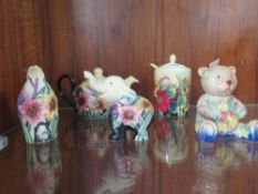 Five pieces of Old Tupton ware ceramics to include a baby elephant and a penguin