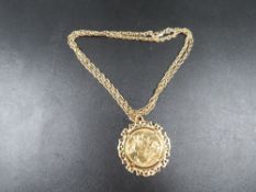 A Victorian sovereign dated 1898 in a unmarked yellow metal mount on a rope twist chain stamped
