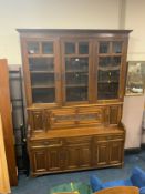A large Edwardian carved oak display cabinet - stamped ‘Thos Turner Manchester’ to the drawer H