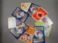 A box of Pokemon cards - holo cards