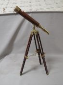 A large brass telescope on tripod