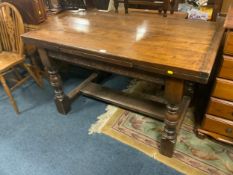 An antique style oak drawleaf table H 77 cm W 132 cm Extended W 208 cm