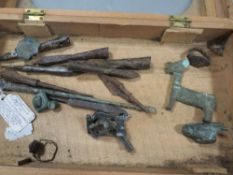A small display box of Roman and later antiques, to include brooches, rings and arrow heads