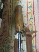 A vintage leather cricket bag, pads, bat and 2 balls