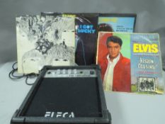 A small Eleca amplifier , guitar tuner etc