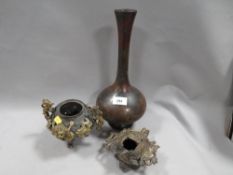 A Tibetan mask censor together with an Oriental dragon embellished incense burner and an Oriental