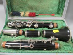 A cased vintage Corton clarinet