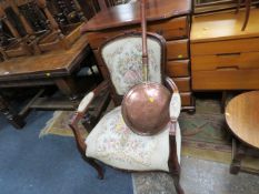 A reproduction tapestry chair together with a copper bed warming pan