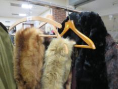 A vintage black fur cape together with a selection of fur stoles and vintage fur coat