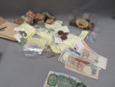 A tray of vintage coins, banknotes, cigarette cards etc