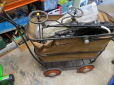 A vintage pram together with a vintage dolls pram