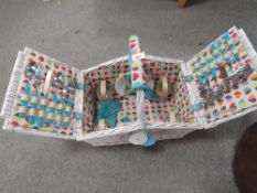 A Beau & Elliott Boutique four person wicker picnic hamper and contents unused with tags