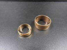 A hallmarked 9 carat gold wedding band approx. weight 9.1g together with an 18 carat gold hallmarked