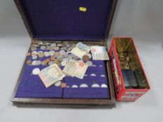 A cutlery box with a tin of collectable coins and notes