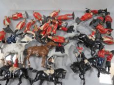 A box of Britains soldiers and horses