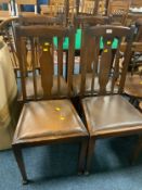A set of four oak 20th century dining chairs
