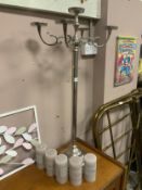 A modern chromed candelabra together with five candles