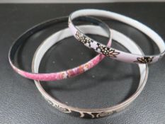 Two Michaela Fray enamel bangles together with a similar unmarked example (3)