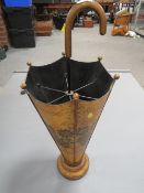 An unusual umbrella / stick stand in the form of an umbrella