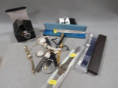 A tray of assorted wrist and pocket watches