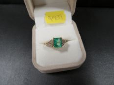 An 18k emerald cut emerald and diamond ring ring size N approx. weight 5.4g