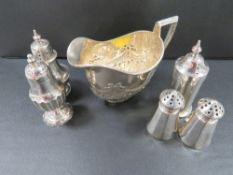 Five hallmarked silver cruets together with a hallmarked silver cream jug
