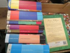 A tray of hard back Harry Potter books etc