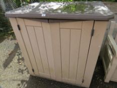 A plastic garden storage cupboard