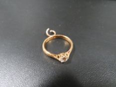 A 22 carat gold ring set with a diamond with additional chain loop approx. weight 3.9g