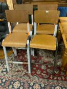 A near set of four industrial style stools