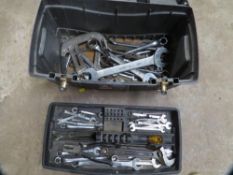 A tool box and contents to include spanners and mechanics tools