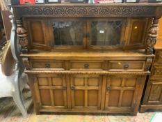 A reproduction oak glazed court cupboard