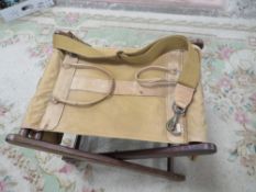 A vintage 'Sandstorm of Kenya' backpack fishing stool