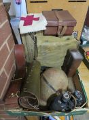 A tray of militaria to include steel helmet, binoculars, WW2 gas mask, Sam Browne belt etc
