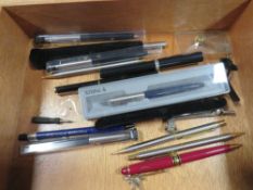 A tray of collectables pens and pencils to include Parker