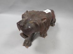 A carved figure of a lion A/F