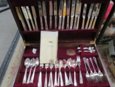 A Viner's canteen of cutlery raised on four legs (unchecked)