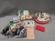 A tray of collectables to include thimbles, watches, cigarette cards etc