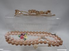 A selection of modern costume jewellery to include Trifari earrings, bracelet etc