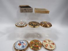 A collection of powder compacts to include Stratton examples