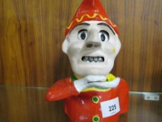 A modern reproduction novelty money box in the form of a clown