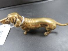 A small cast brass figure of a Dachshund dog